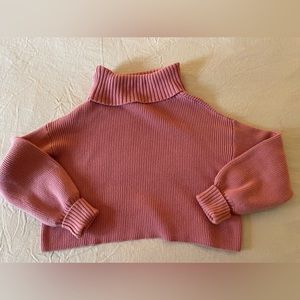 Pink cropped turtleneck sweater